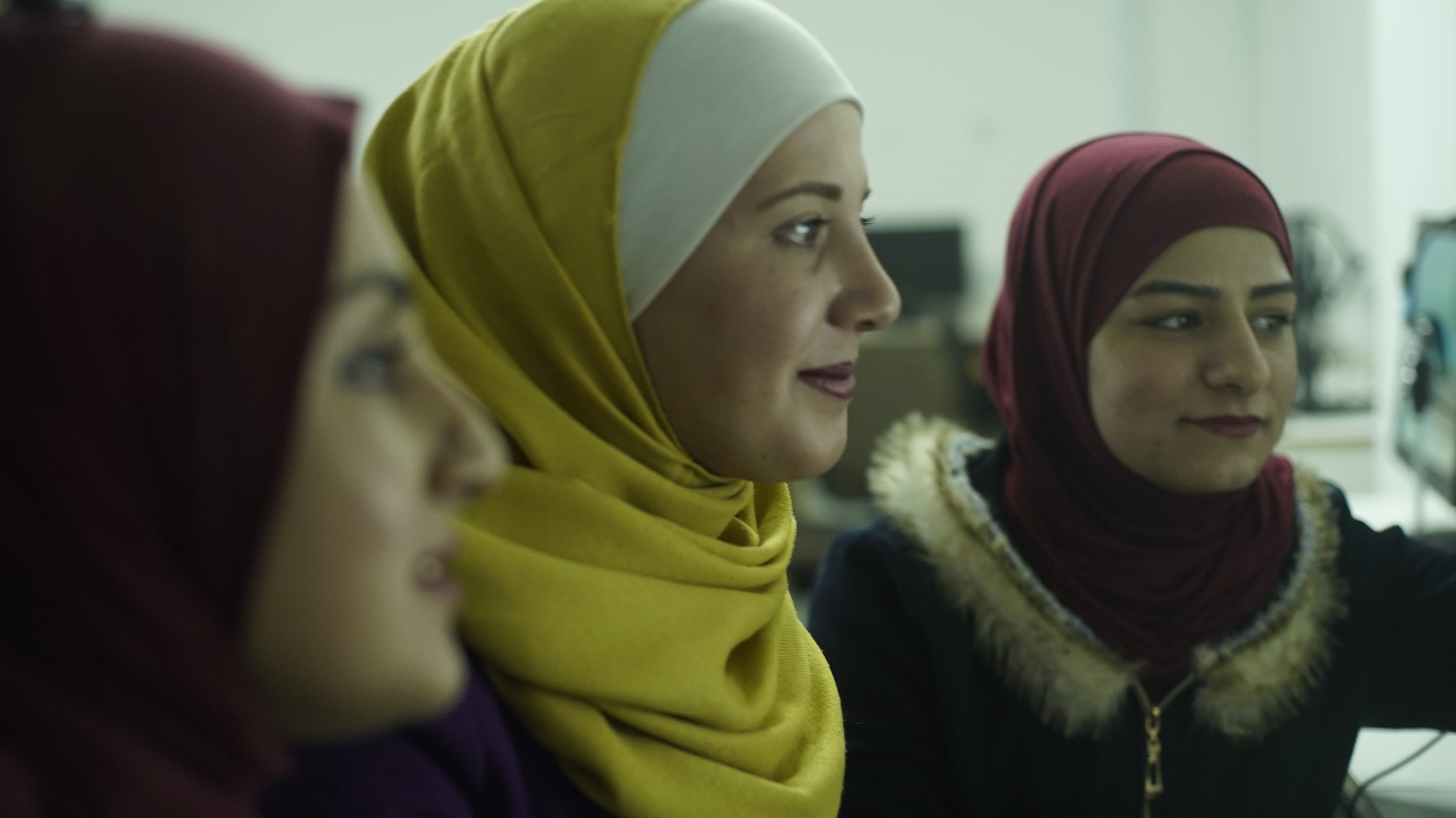 three female students working