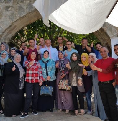 group of participants and facilitators posing