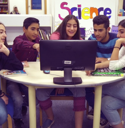 students around computer