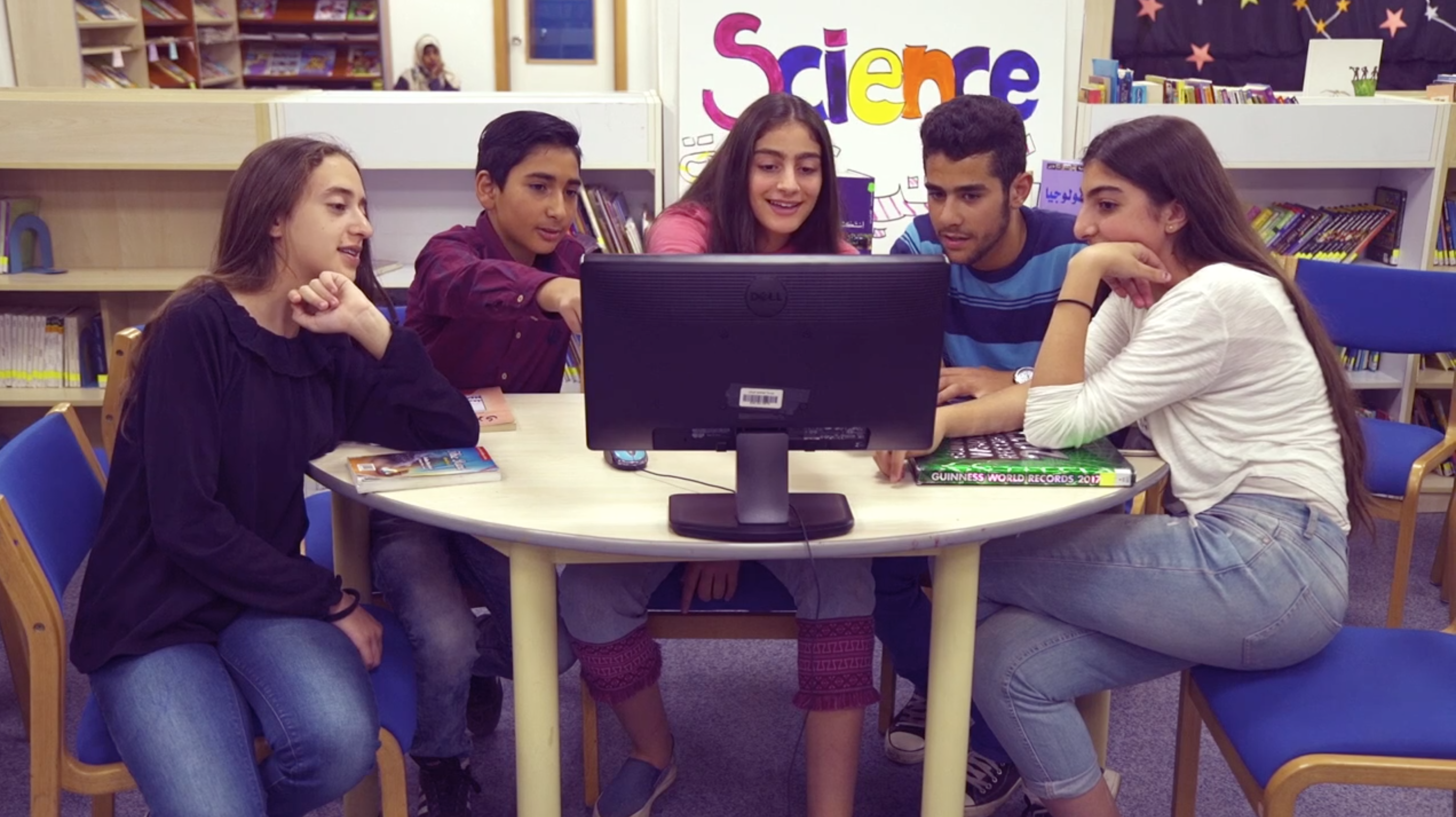 students around computer